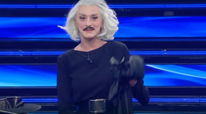 “Dio Cristo”, il travestito Drusilla tira fuori il camionista che è in ‘lei’: Sanremo trash